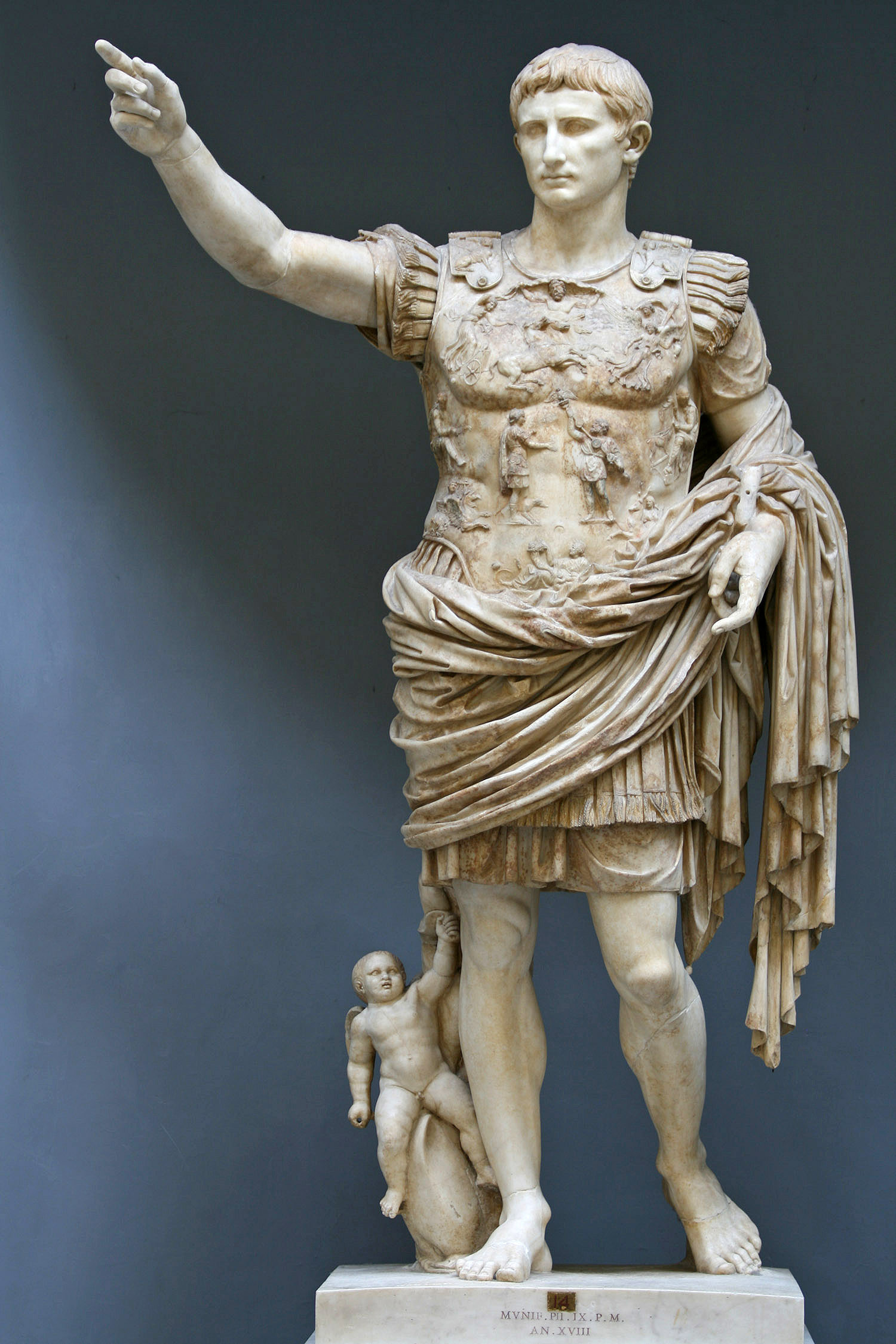 Marble statue of Augustus dressed in military wear.