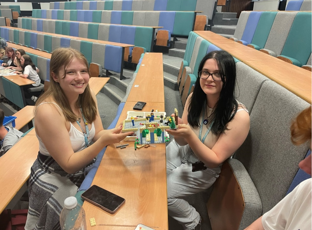 students at the university access day holding lego models of Ancient Greek architecture 