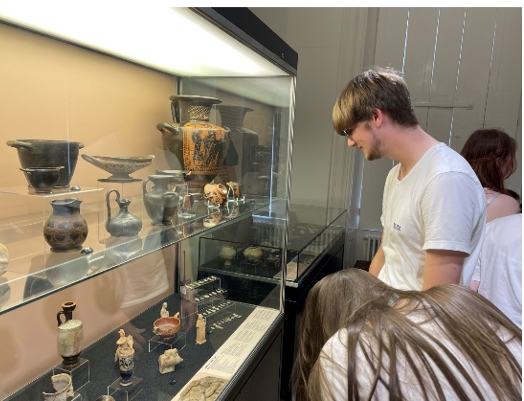 University Access Project - Pilot Day at the University of Liverpool - Student looking at Ancient Greek pots